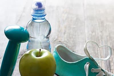 tennis shoe, water, apple and hand-weight