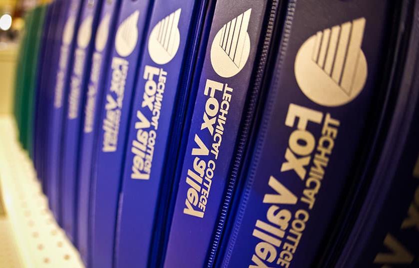 fox valley tech binders on a shelf